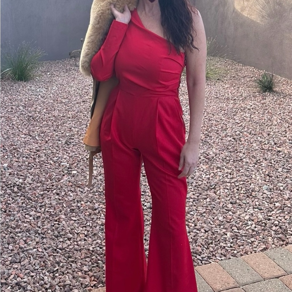 Marcell Von Berlin bold red designer jump suit and chunky heeled booties